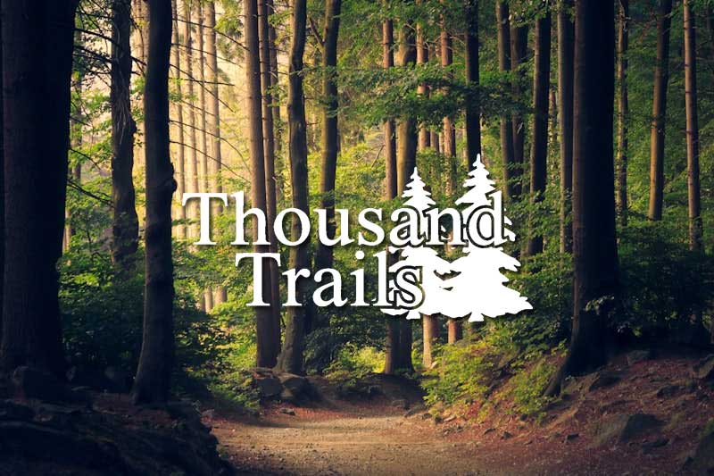 A stylized Thousand Trails network logo badge on a clean background, representing pre-owned campground membership resale options for RV travel.